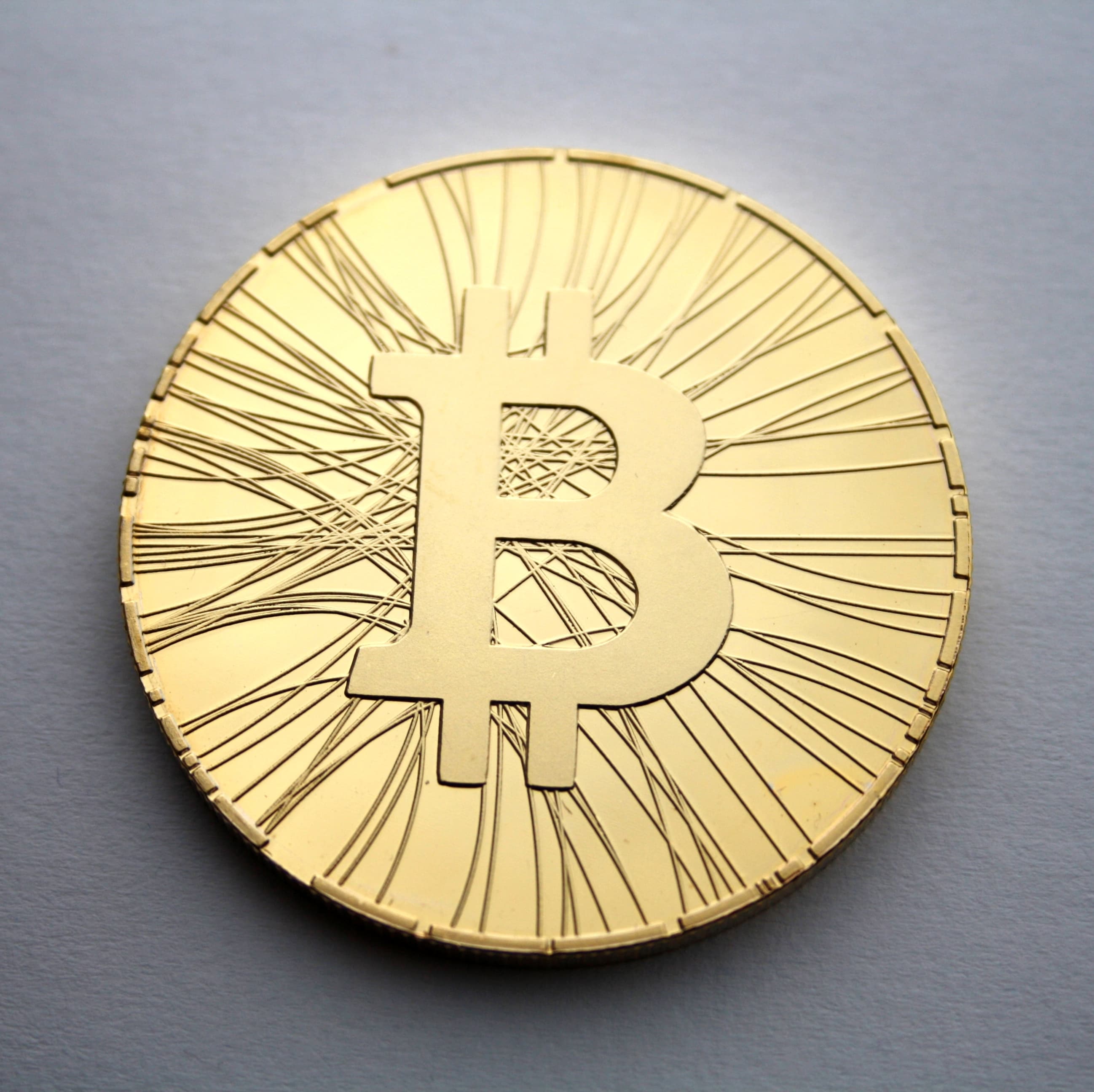 Physical Bitcoin cryptocurrency coin with circuitry pattern design