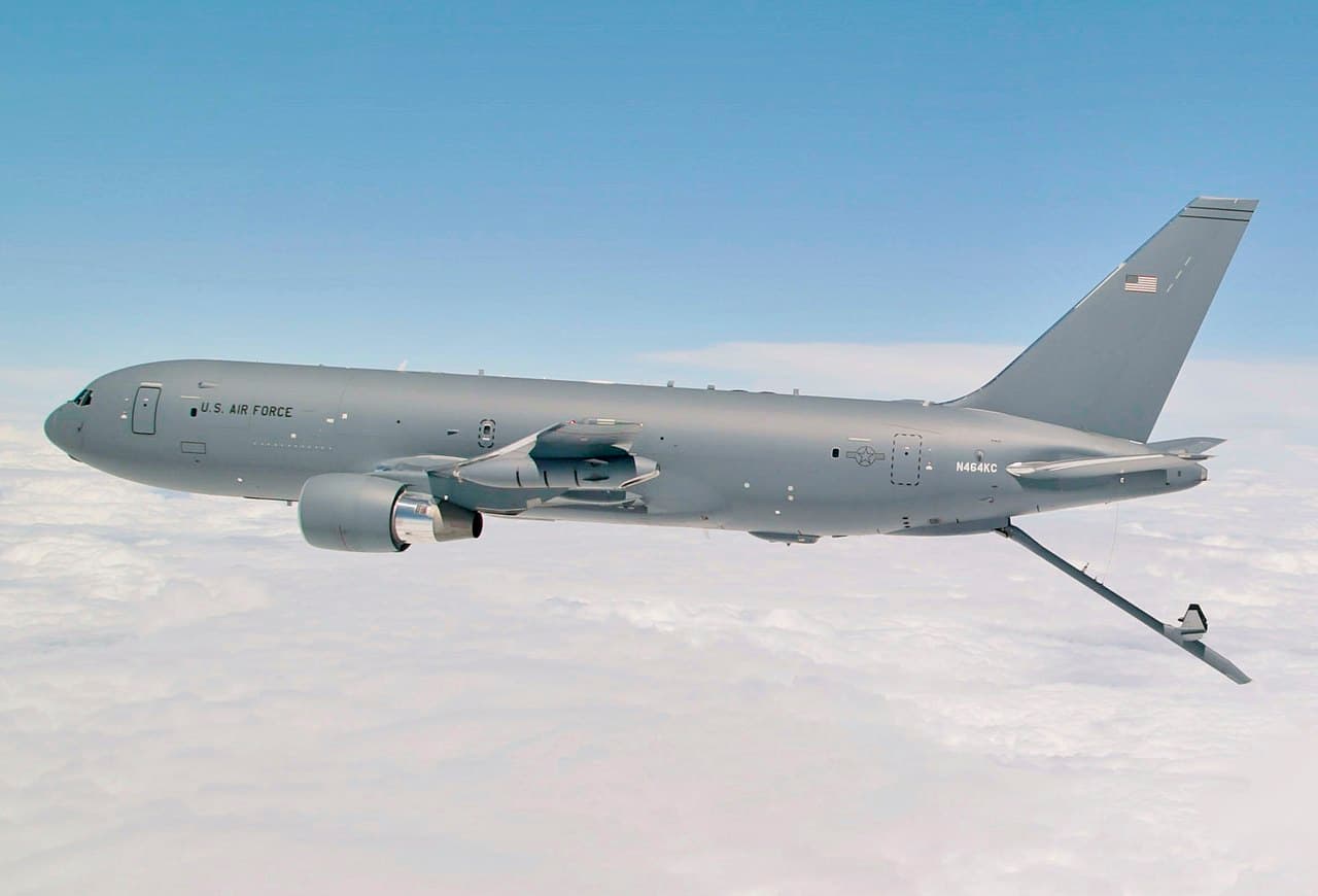 Boeing KC-46 Pegasus tanker aircraft preparing to refuel a C-17 Globemaster in flight